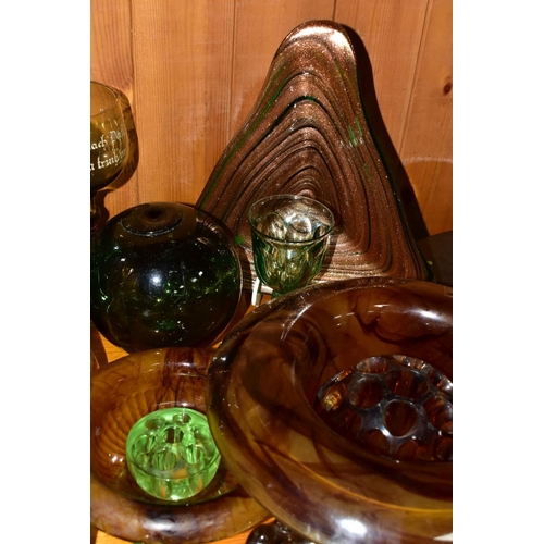 570 - A GROUP OF GREEN, BROWN AND URANIUM GLASSWARES, to include pressed glass furniture rests/piano insul... 