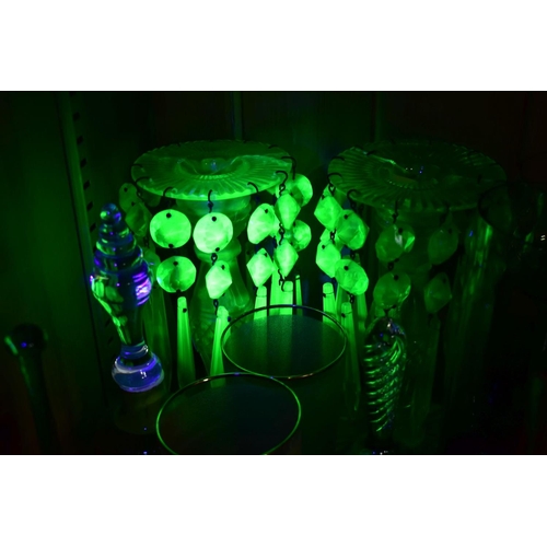 570 - A GROUP OF GREEN, BROWN AND URANIUM GLASSWARES, to include pressed glass furniture rests/piano insul... 