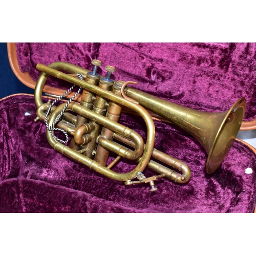 582 - A CASED LAFLEUR BRASS CORNET Serial No 658000 (brass is tarnished, one valve doesn't return and spit... 