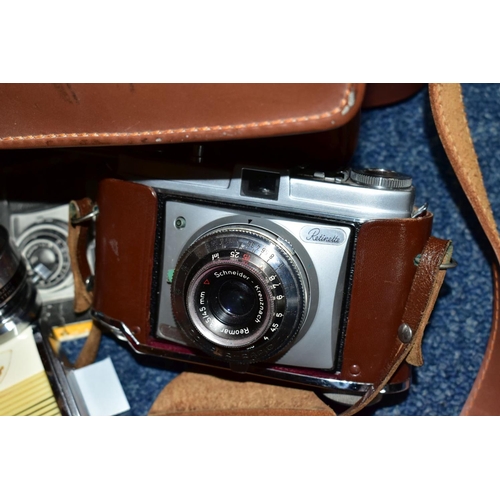 585 - A CAMERA BAG CONTAINING A KODAK RETINETTE FILM CAMERA, a Sun tele converter, Voigtander Rangefinder,... 