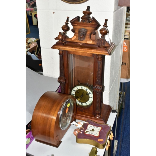 592 - WALL AND MANTLE CLOCKS ETC, comprising a Hamburg American Clock company wall clock in need restorati... 