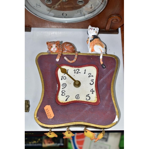 592 - WALL AND MANTLE CLOCKS ETC, comprising a Hamburg American Clock company wall clock in need restorati... 