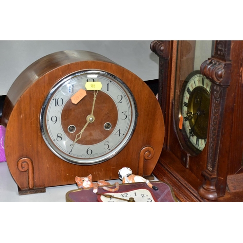 592 - WALL AND MANTLE CLOCKS ETC, comprising a Hamburg American Clock company wall clock in need restorati... 