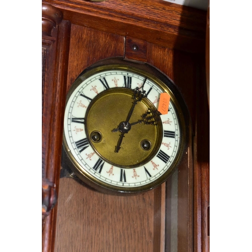 592 - WALL AND MANTLE CLOCKS ETC, comprising a Hamburg American Clock company wall clock in need restorati... 