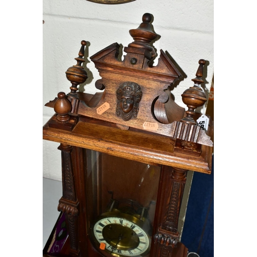 592 - WALL AND MANTLE CLOCKS ETC, comprising a Hamburg American Clock company wall clock in need restorati... 