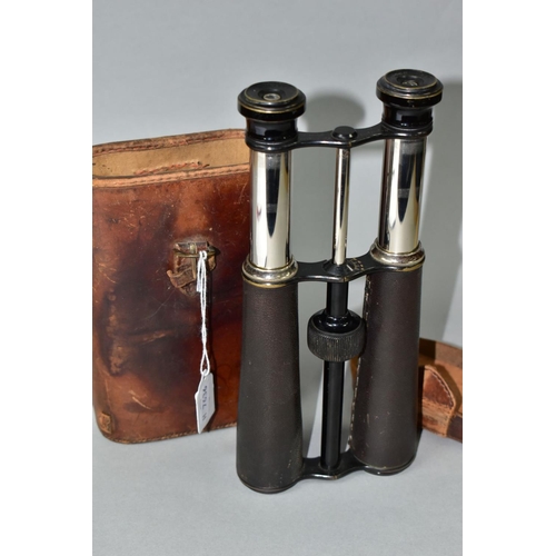 597 - A PAIR OF 14X MAGNIFICATION BINOCULARS BY LLOYD OPTICIAN OF BOSTON, the leather to one barrel has be... 