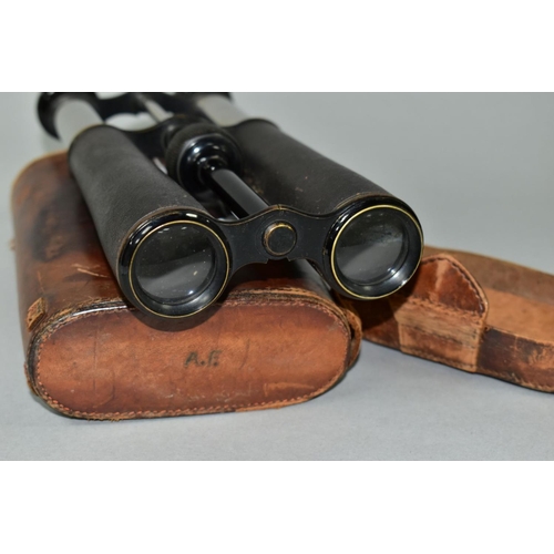 597 - A PAIR OF 14X MAGNIFICATION BINOCULARS BY LLOYD OPTICIAN OF BOSTON, the leather to one barrel has be... 