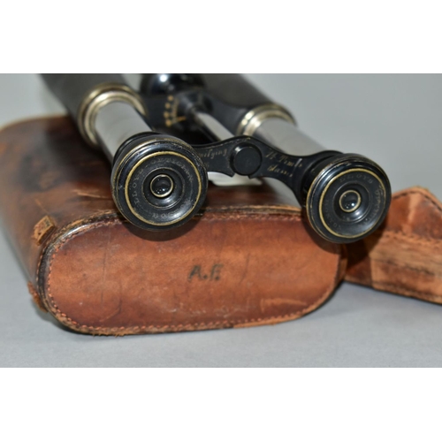 597 - A PAIR OF 14X MAGNIFICATION BINOCULARS BY LLOYD OPTICIAN OF BOSTON, the leather to one barrel has be... 