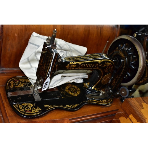 603 - A LATE VICTORIAN SINGER SEWING MACHINE, complete with wooden case, together with drawing instruments... 