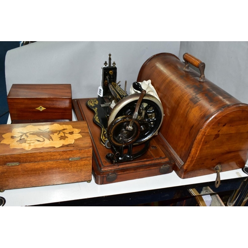 603 - A LATE VICTORIAN SINGER SEWING MACHINE, complete with wooden case, together with drawing instruments... 