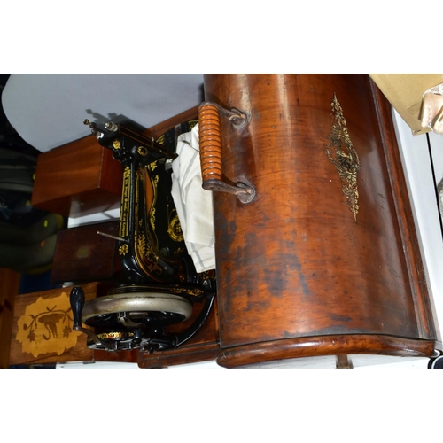 603 - A LATE VICTORIAN SINGER SEWING MACHINE, complete with wooden case, together with drawing instruments... 