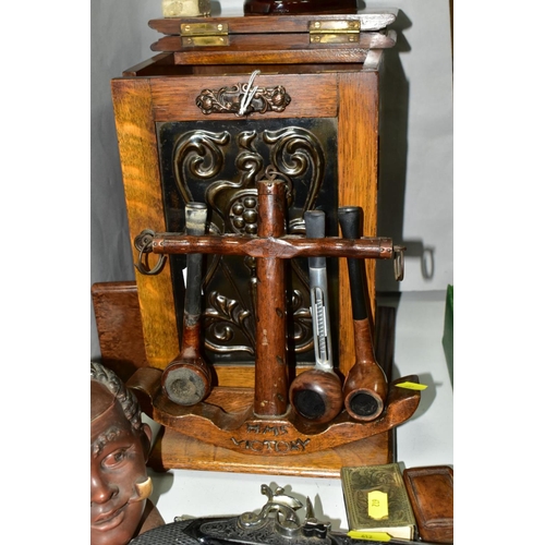 612 - AN OAK PIPE SMOKERS CABINET WITH ART NOUVEAU METAL PANEL INSET TO DOOR, together with smoking relate... 