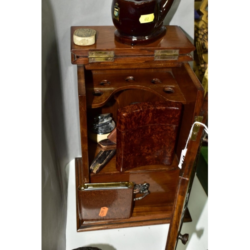 612 - AN OAK PIPE SMOKERS CABINET WITH ART NOUVEAU METAL PANEL INSET TO DOOR, together with smoking relate... 