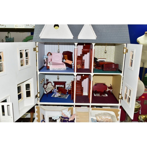 657 - A LARGE MODERN WOODEN DOLLS HOUSE, modelled as a two storey Georgian style house with basement and a... 