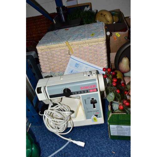 693 - FOUR BOXES AND LOOSE SUNDRY ITEMS, to include a Singer Featherweight Plus sewing machine and a baske... 