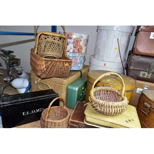 694 - A QUANTITY OF VINTAGE LUGGAGE, BASKETS, ETC, to include four brown vintage suitcases, most with trav... 