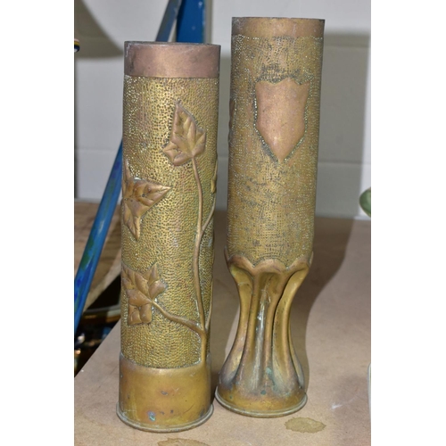 712 - TRENCH ART, four WWI brass shell cases embossed with foliate designs, one titled 'CHAMPAGNE' towards... 