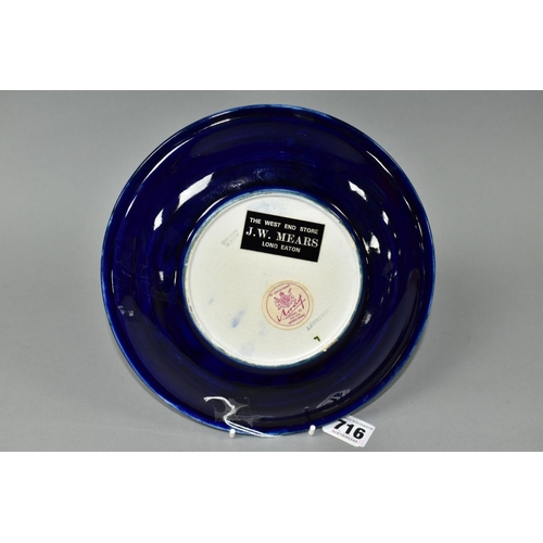 716 - A MOORCROFT POTERY CLEMATIS PATTERN SHALLOW DISH, paper Moorcroft label 'Potters to the Late Queen M... 