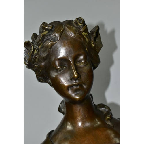 723 - A PATINATED BRONZE BUST, young female with head bowed, garlands in hair and tied shawl over shoulder... 