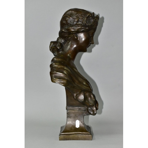 723 - A PATINATED BRONZE BUST, young female with head bowed, garlands in hair and tied shawl over shoulder... 