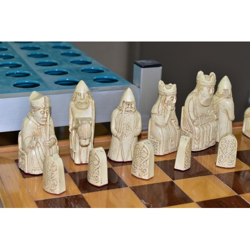 747 - AN ISLE OF LEWIS STYLE CHESS SET, with wooden board 49.5cm square, cast resin cream and black pieces... 