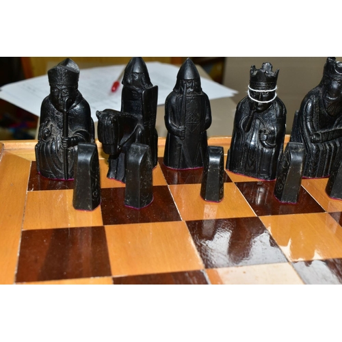 747 - AN ISLE OF LEWIS STYLE CHESS SET, with wooden board 49.5cm square, cast resin cream and black pieces... 