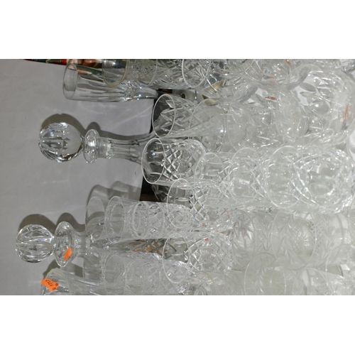 754 - A QUANTITY OF CUT CRYSTAL AND OTHER GLASSWARES, to include three decanters, three large vases talles... 