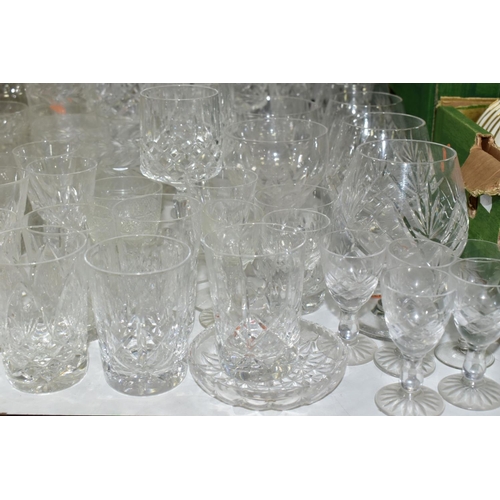 754 - A QUANTITY OF CUT CRYSTAL AND OTHER GLASSWARES, to include three decanters, three large vases talles... 