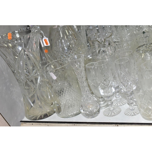 754 - A QUANTITY OF CUT CRYSTAL AND OTHER GLASSWARES, to include three decanters, three large vases talles... 