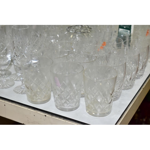 754 - A QUANTITY OF CUT CRYSTAL AND OTHER GLASSWARES, to include three decanters, three large vases talles... 