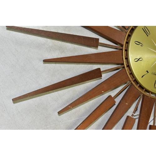 770 - A SETH THOMAS OF SCOTLAND TEAK SUNBURST WALL CLOCK, Arabic numerals, missing one of the metal and wo... 