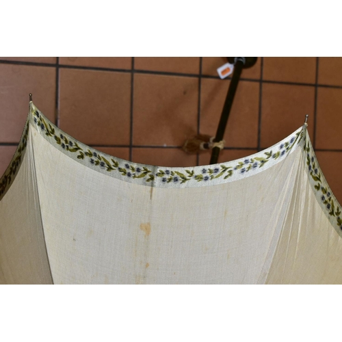 778 - AN EDWARDIAN SILK PARASOL, cream silk canopy and green stained wooden shaft, approximate length 92cm... 