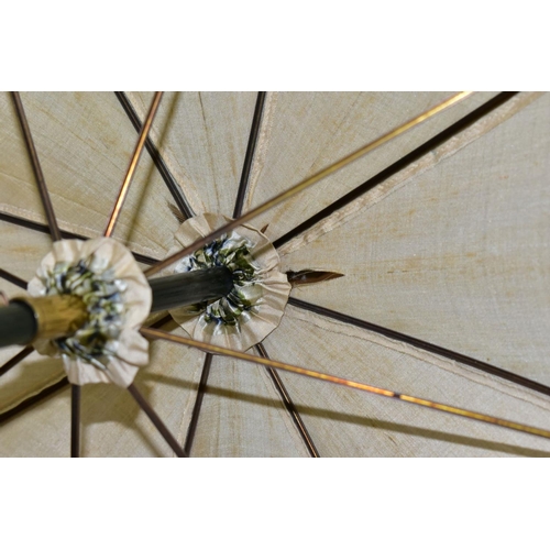 778 - AN EDWARDIAN SILK PARASOL, cream silk canopy and green stained wooden shaft, approximate length 92cm... 