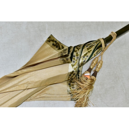 778 - AN EDWARDIAN SILK PARASOL, cream silk canopy and green stained wooden shaft, approximate length 92cm... 