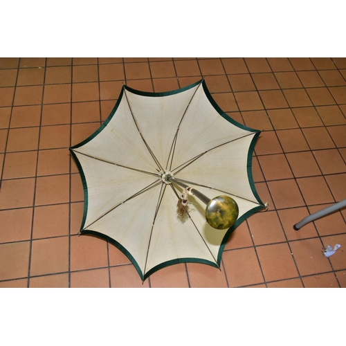 778 - AN EDWARDIAN SILK PARASOL, cream silk canopy and green stained wooden shaft, approximate length 92cm... 