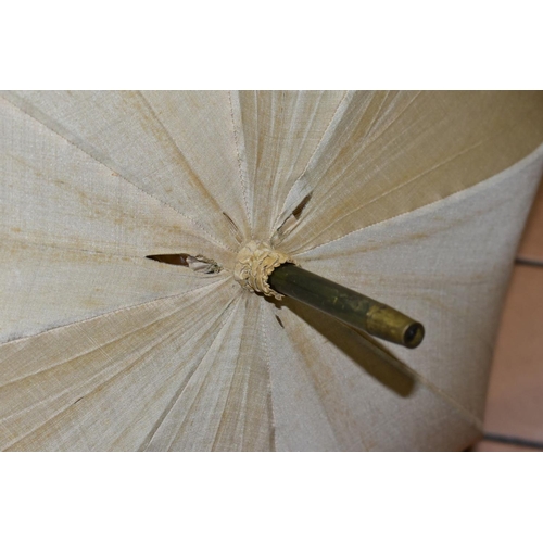 778 - AN EDWARDIAN SILK PARASOL, cream silk canopy and green stained wooden shaft, approximate length 92cm... 