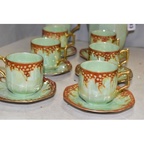 783 - A 1920S RUDOLPH WACHTER GREEN AND ORANGE LUSTRE OCTAGONAL FOURTEEN PIECE PORCELAIN COFFEE SET, compr... 