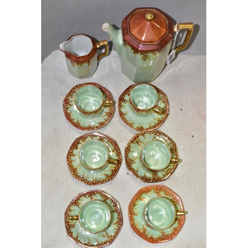 783 - A 1920S RUDOLPH WACHTER GREEN AND ORANGE LUSTRE OCTAGONAL FOURTEEN PIECE PORCELAIN COFFEE SET, compr... 