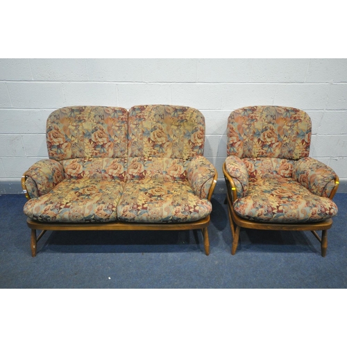 1385 - AN ERCOL ELM WINDSOR JUBILEE TWO PIECE LOUNGE SUITE, comprising of a two seater sofa and an arm chai... 