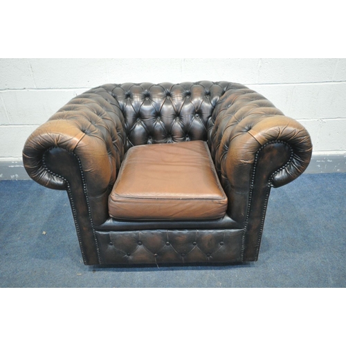 1386 - A BROWN LEATHER BUTTONED CHESTERFIELD CLUB ARMCHAIR (condition - some fading to arms, some replaceme... 