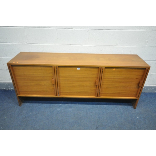 1391 - A MID CENTURY DANISH STYLE WALNUT SIDEBOARD, with three cupboard doors, right door enclosing two dra... 