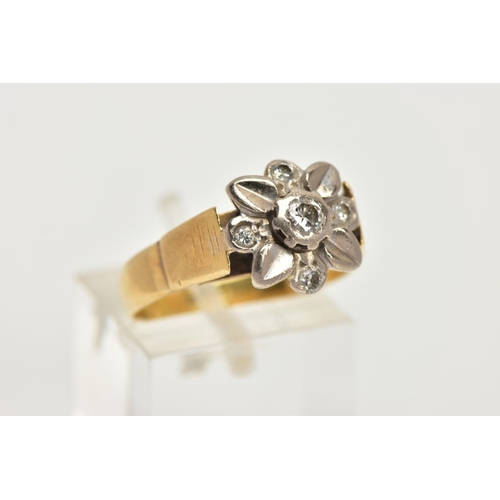 10 - A WHITE AND YELLOW METAL DIAMOND CLUSTER RING, a floral design ring in white metal set with a centra... 