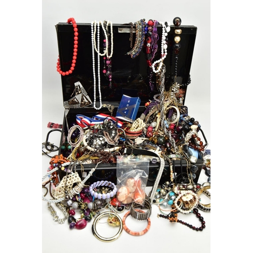 155 - A BLACK TIN FILLED WITH COSTUME JEWELLERY, to include various beaded necklaces, bangles, a bag of lo... 