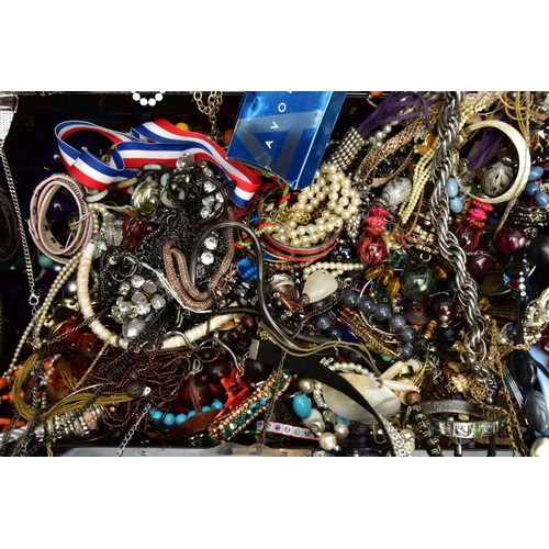 155 - A BLACK TIN FILLED WITH COSTUME JEWELLERY, to include various beaded necklaces, bangles, a bag of lo... 