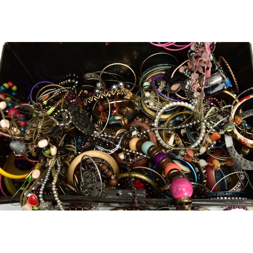 156 - A BLACK TIN FILLED WITH COSTUME JEWELLERY, to include various bangles, beaded necklaces, etc