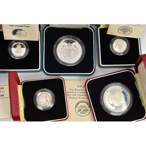 172 - A CARDBOARD BOX CONTAINING MAINLY ROYAL MINT SILVER PROOF BOXED COINS, to include a 1985 GWR 150 ann... 