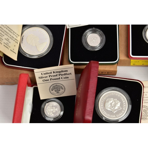 172 - A CARDBOARD BOX CONTAINING MAINLY ROYAL MINT SILVER PROOF BOXED COINS, to include a 1985 GWR 150 ann... 