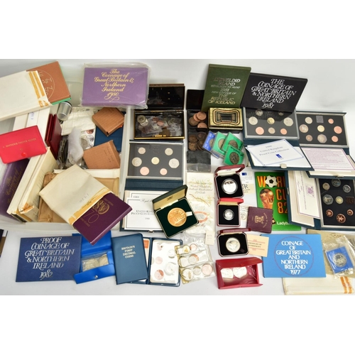 186 - A CARDBOARD BOX OF MIXED COINS AND YEAR SETS, to include five UK royal mint proof year sets 1983,198... 