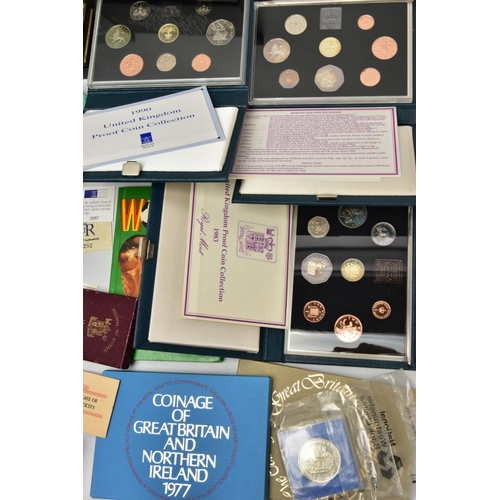 186 - A CARDBOARD BOX OF MIXED COINS AND YEAR SETS, to include five UK royal mint proof year sets 1983,198... 