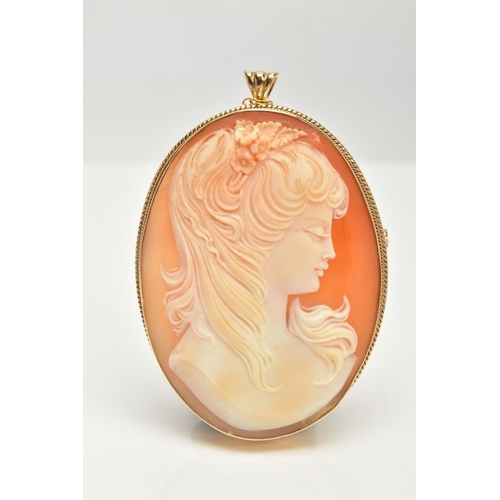 19 - A 9CT GOLD CAMEO BROOCH, oval carved shell depicting a lady in profile, bezel setting with a fine ro... 